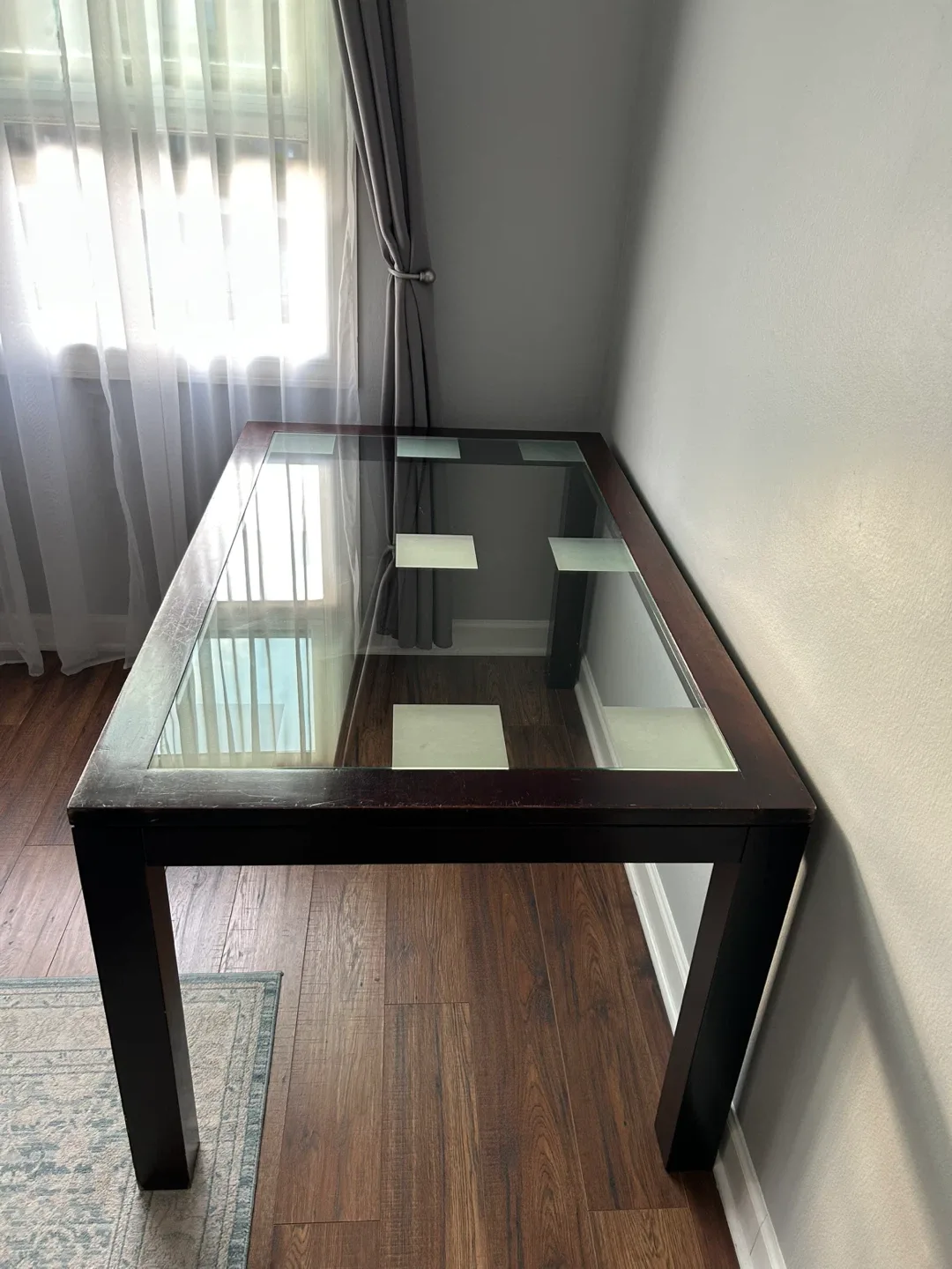 Glass Top Dining Table with Dark Wood Frame