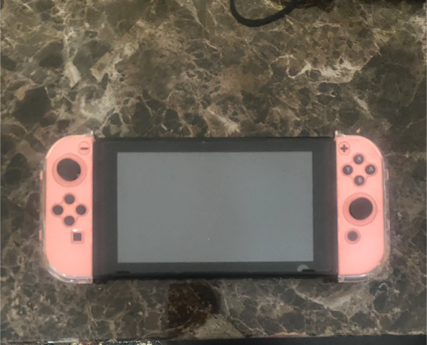 Nintendo Switch with pink protective case
