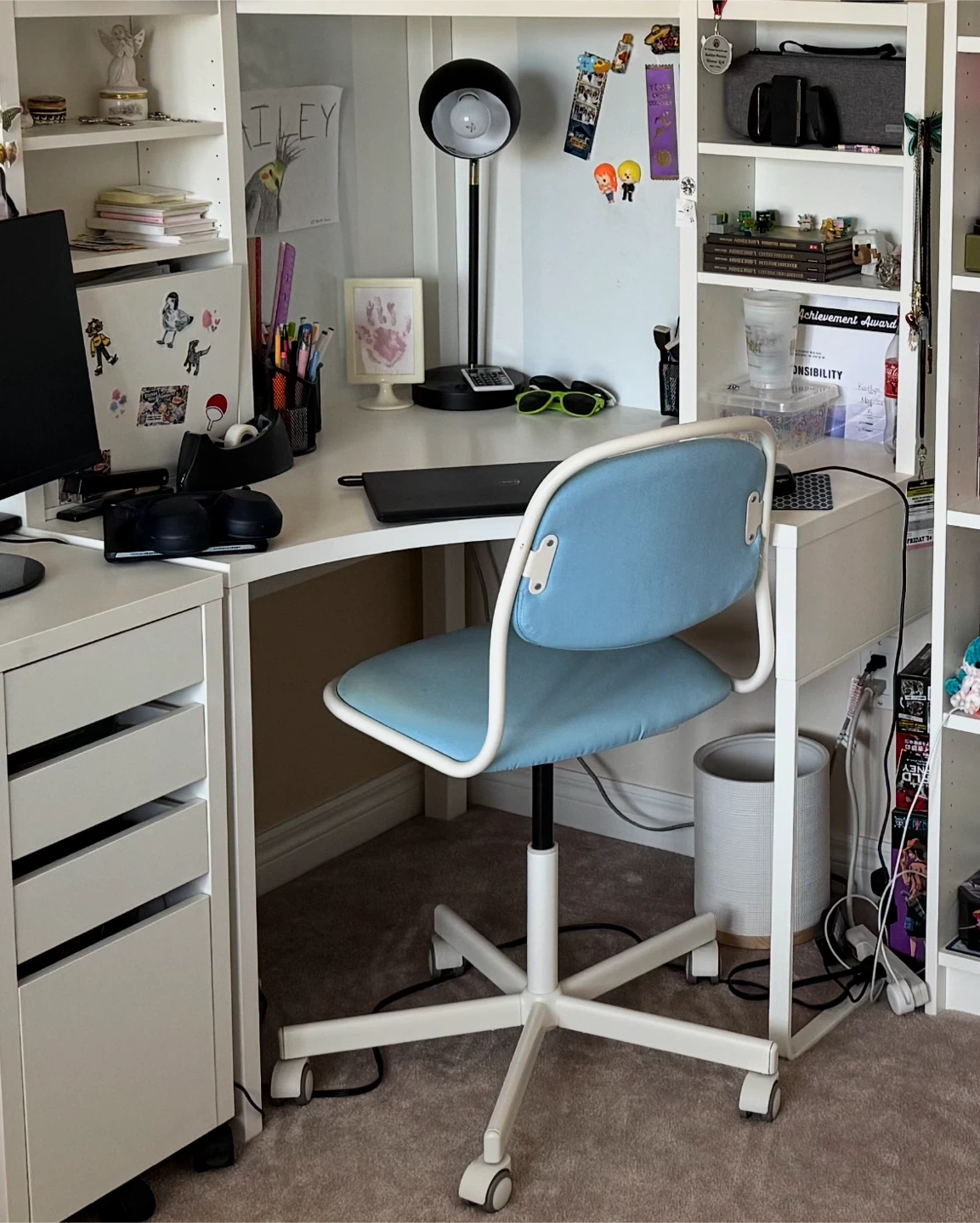 White IKEA corner desk with Light Blue Desk Chair