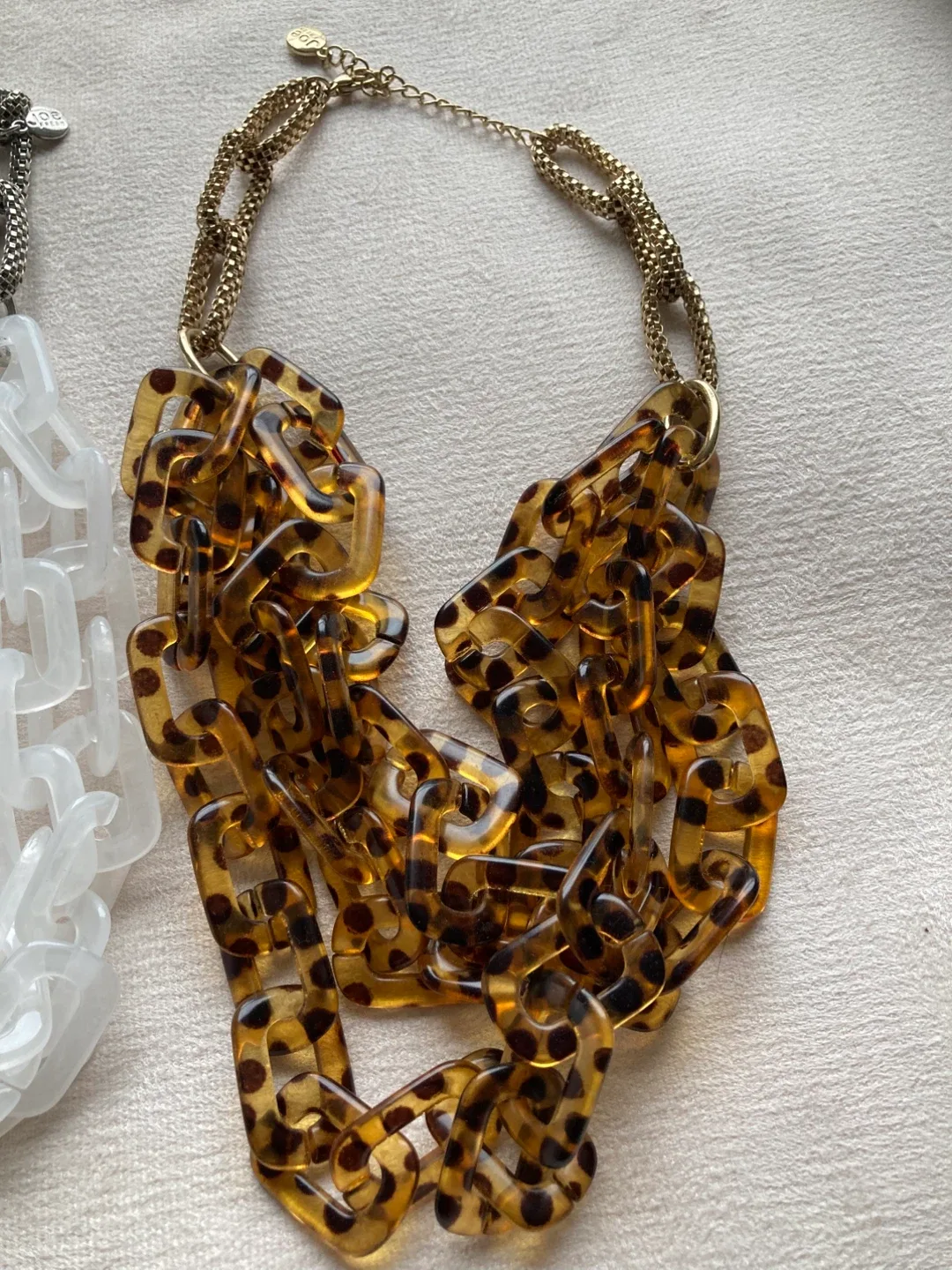 White and animal print statement necklaces image indicator(2)