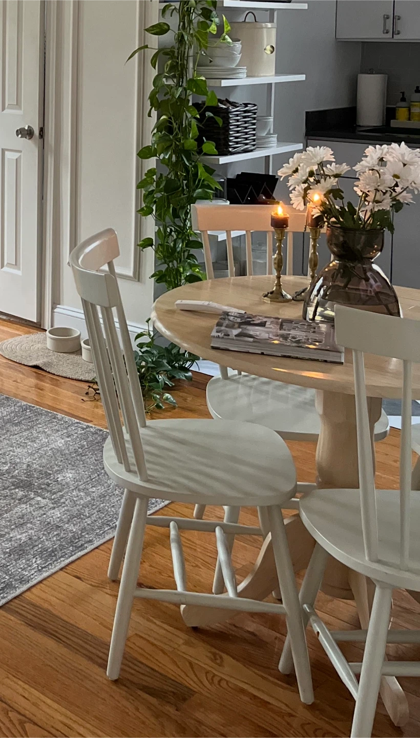 Round wooden table and four chairs