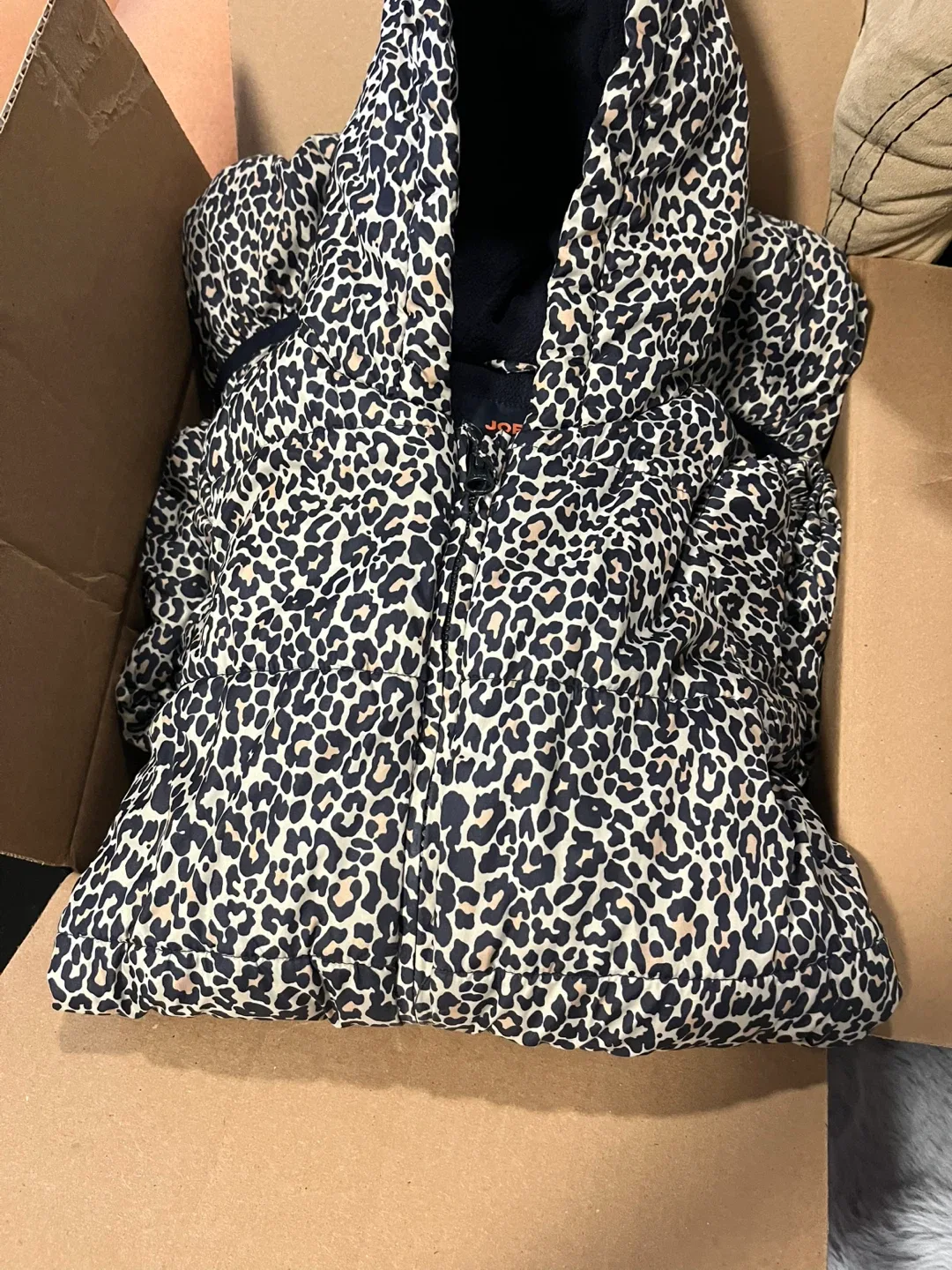 Mix baby clothes and a winter jacket