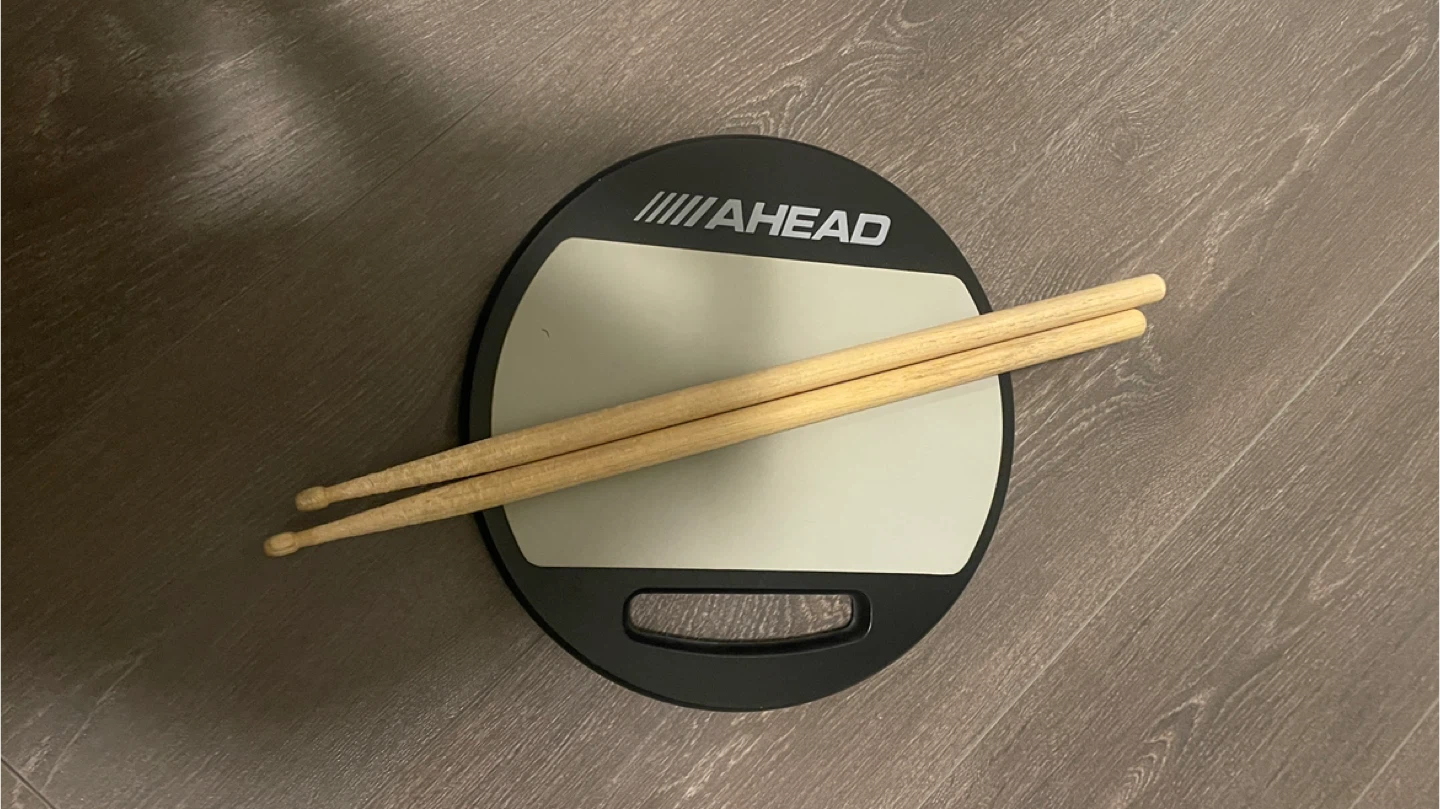Drum practice pad and sticks