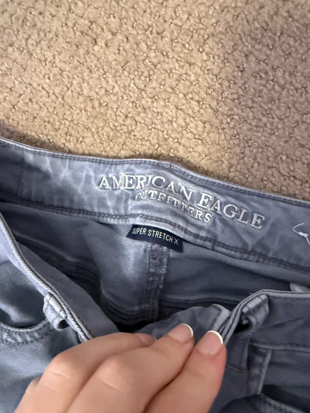 American Eagle Grey Ripped Jeans image indicator(3)