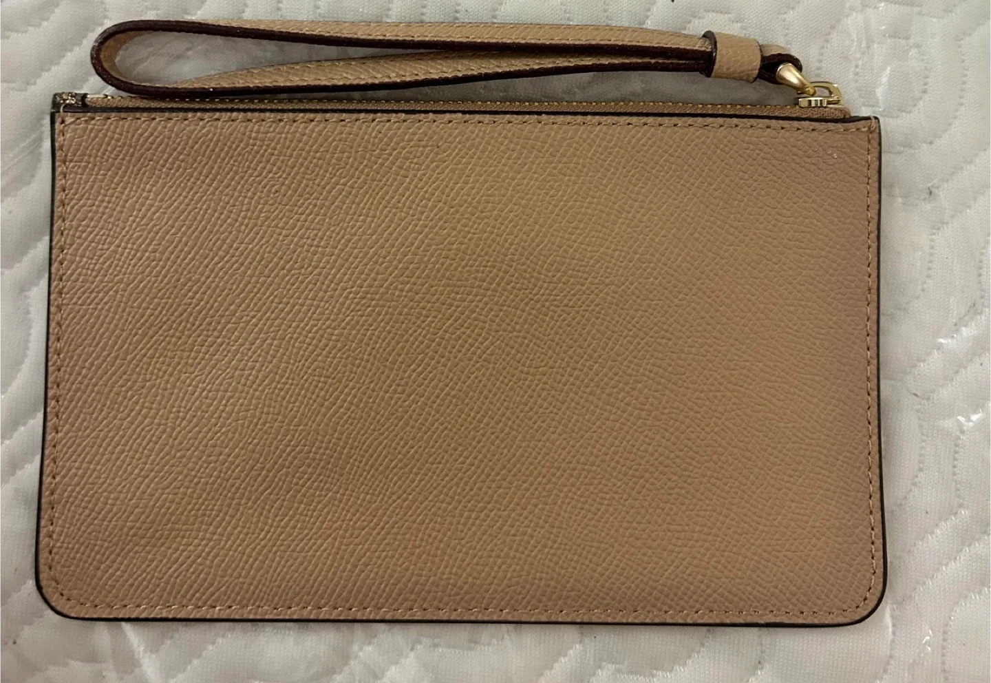 Glittery gold Coach Wristlet image indicator(2)