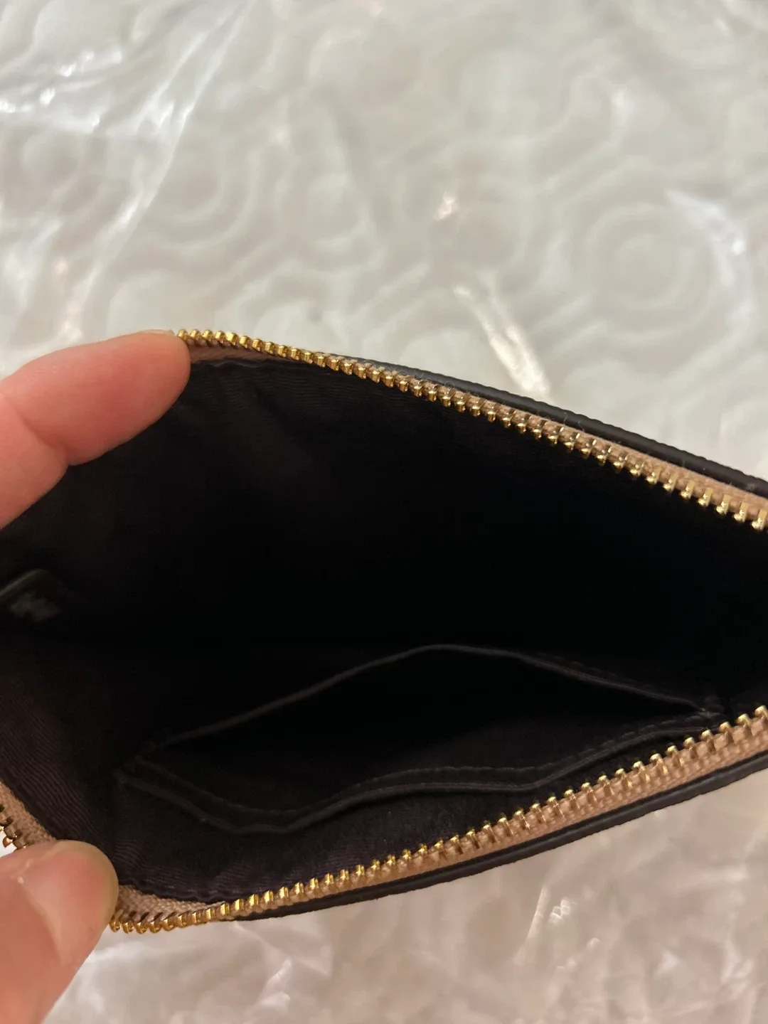 Glittery gold Coach Wristlet image indicator(3)