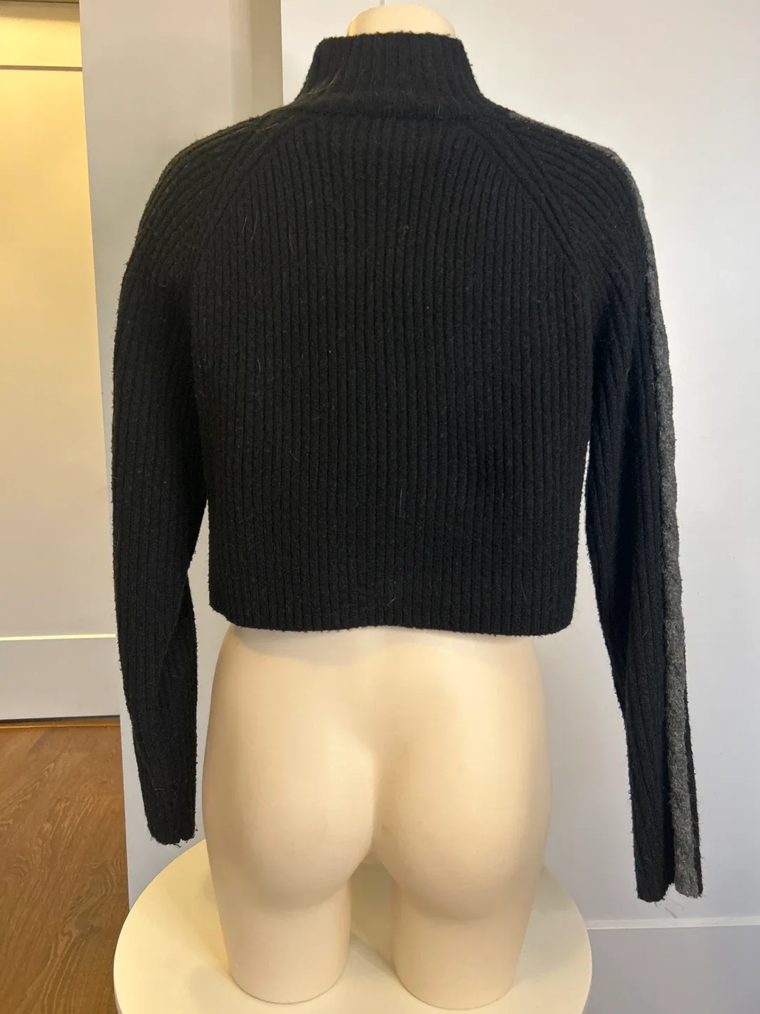 Black cropped half zip sweater with grey stripe image indicator(2)