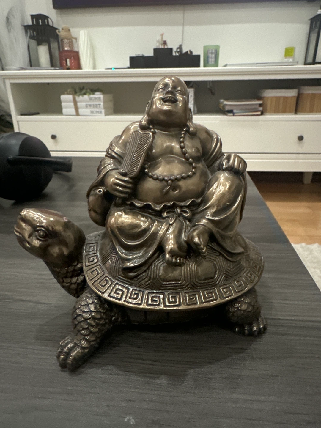 Buddha riding turtle statue