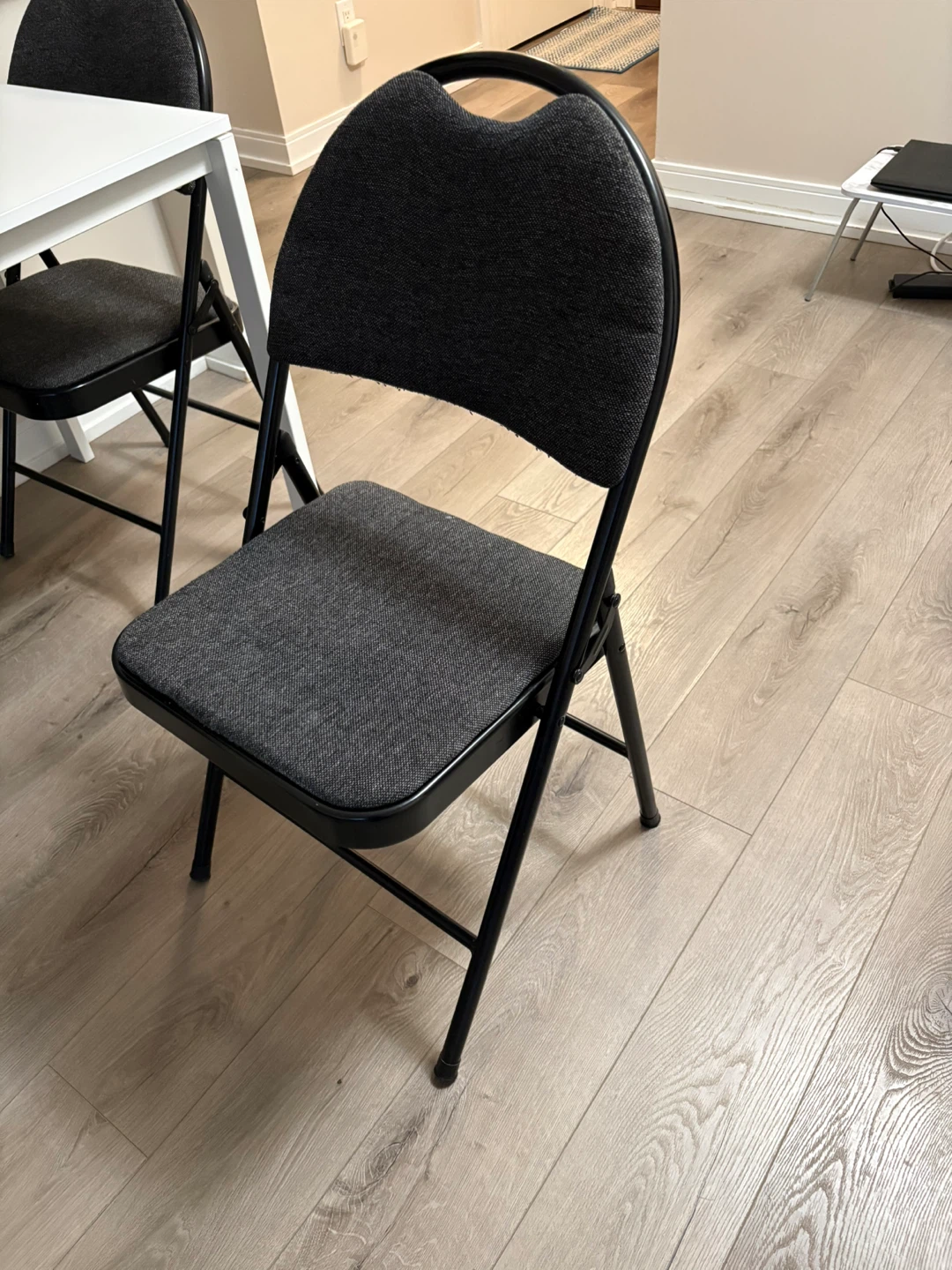 Black foldable chair for $10 each