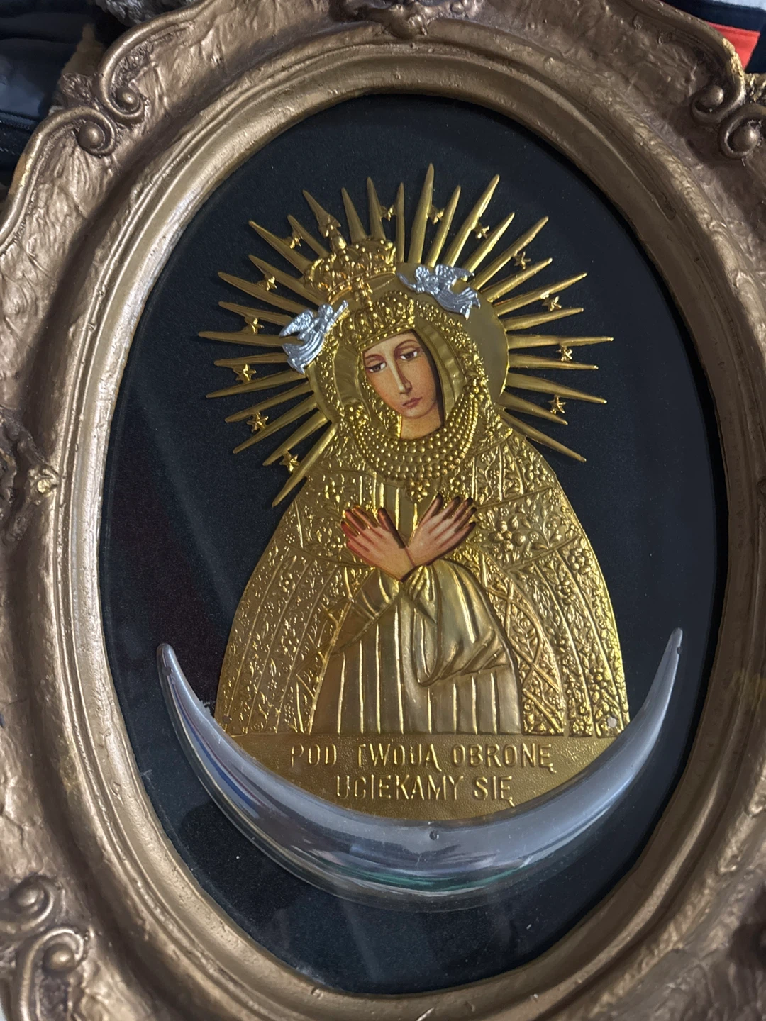 Blessed mother in a wood frame antique.