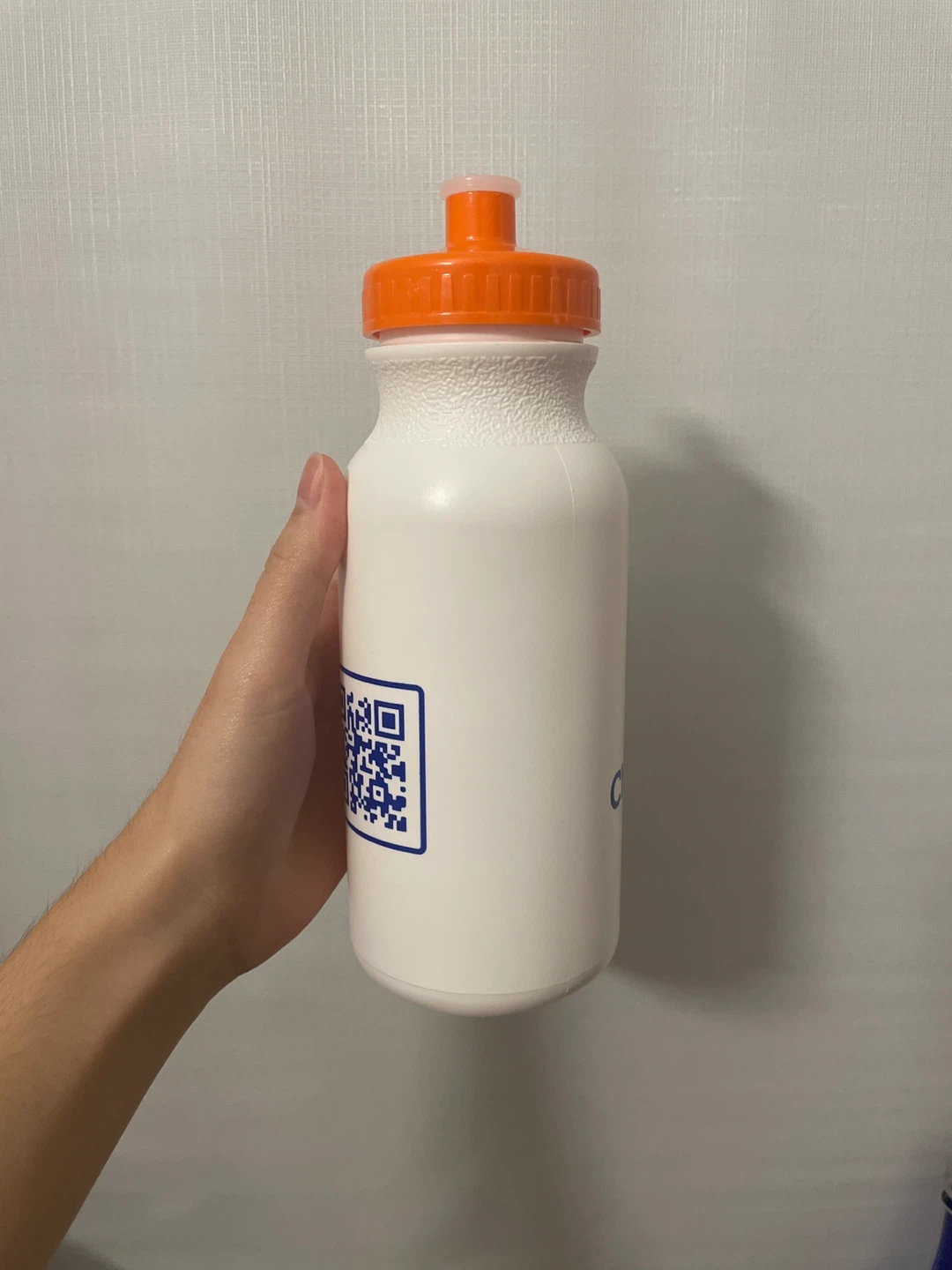 White water bottle with orange lid