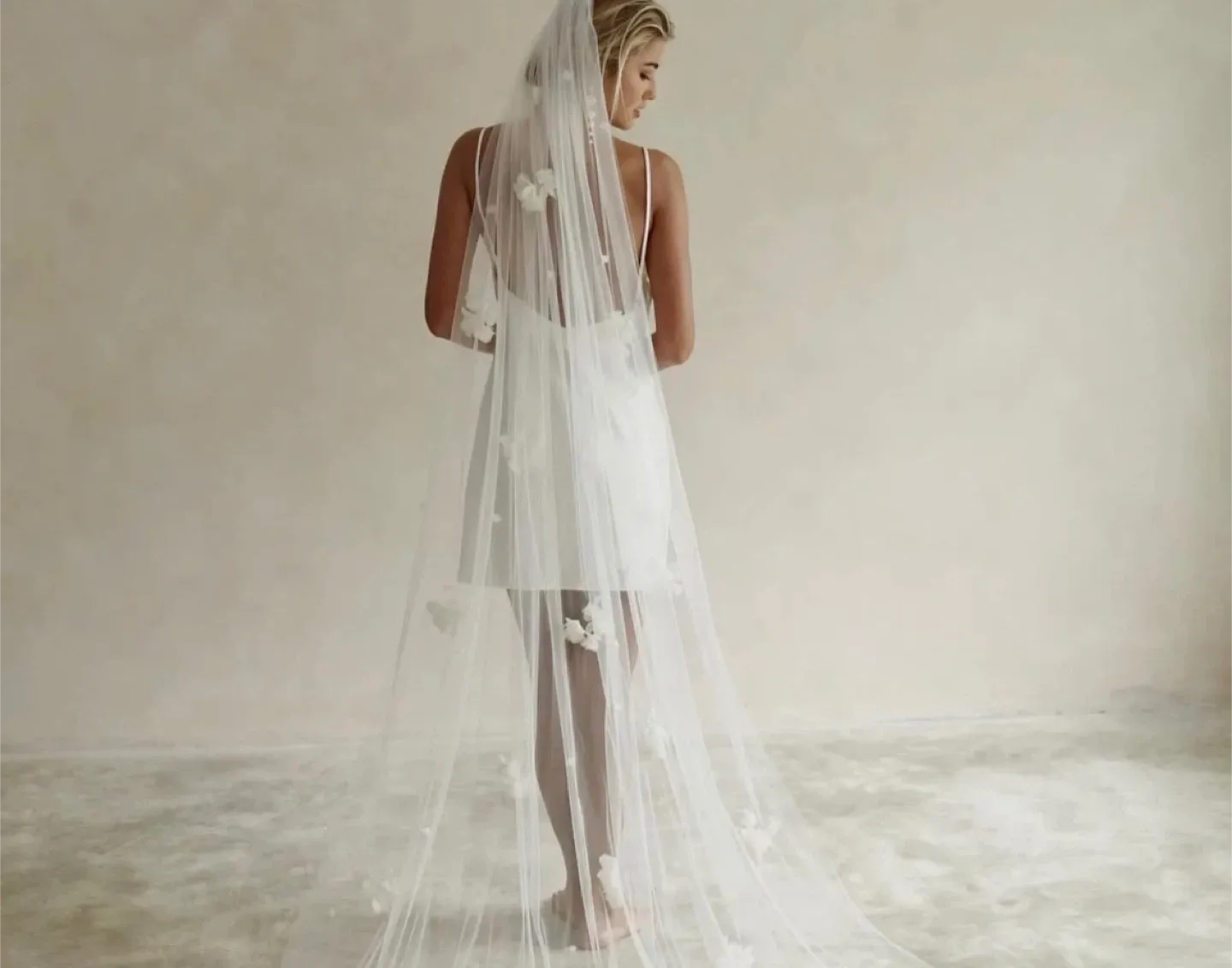 Floor length soft white wedding Veil with Floral Appliqués image indicator(2)