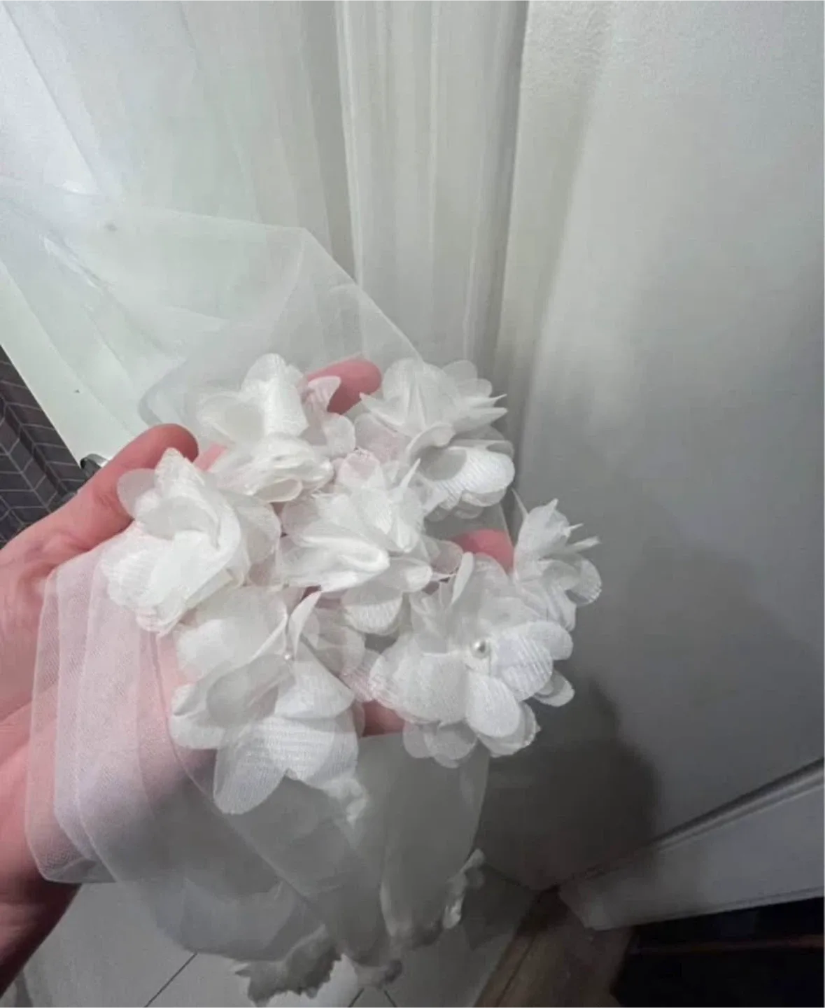 Floor length soft white wedding Veil with Floral Appliqués image indicator(6)