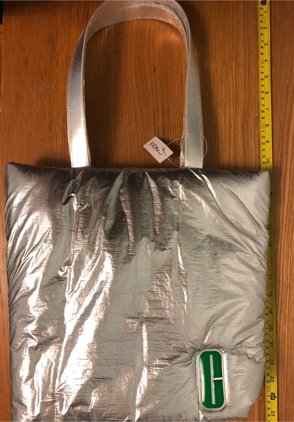 A New Clinique Silver Puffer Tote Bag image indicator(8)