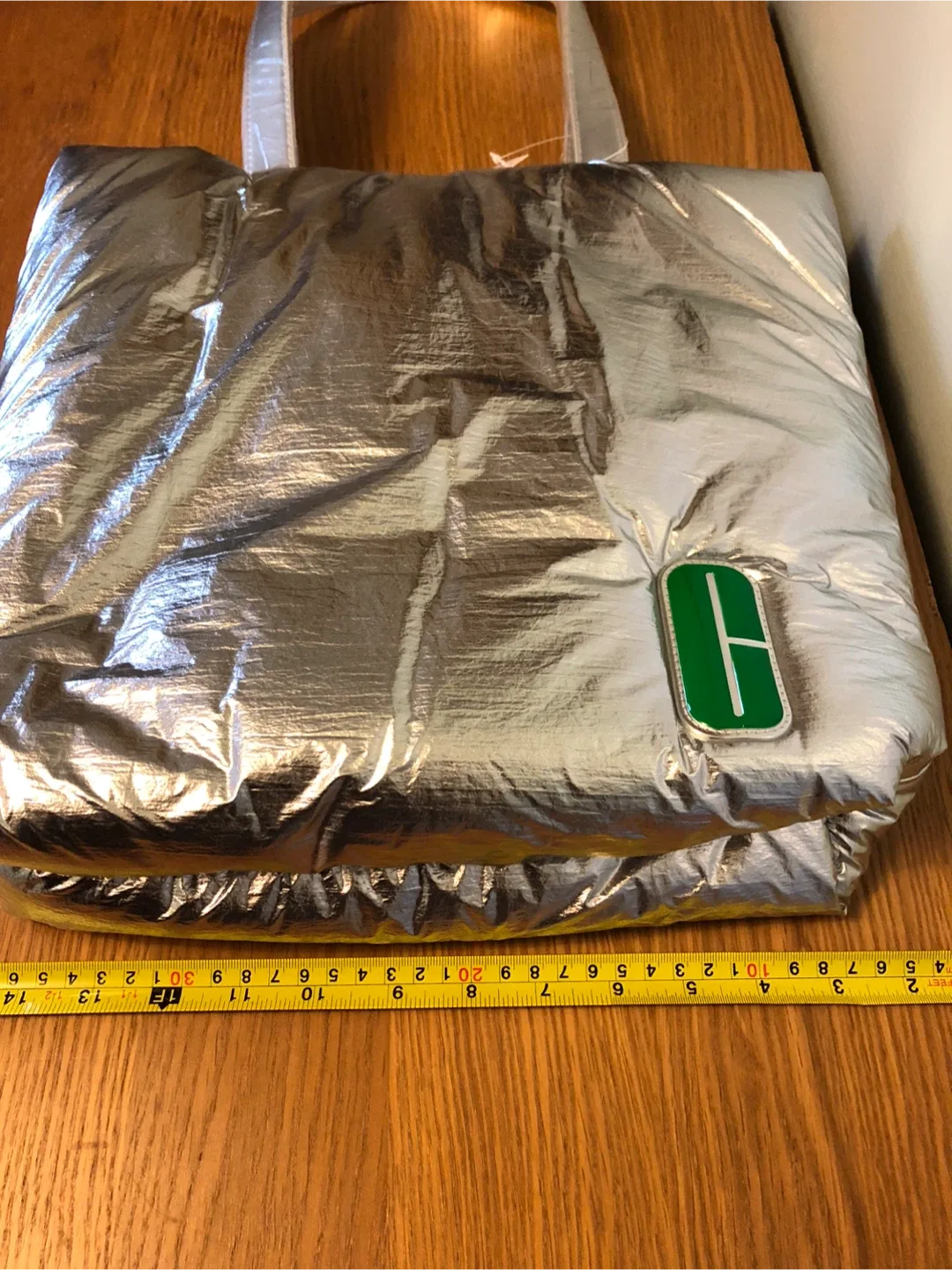 A New Clinique Silver Puffer Tote Bag image indicator(3)