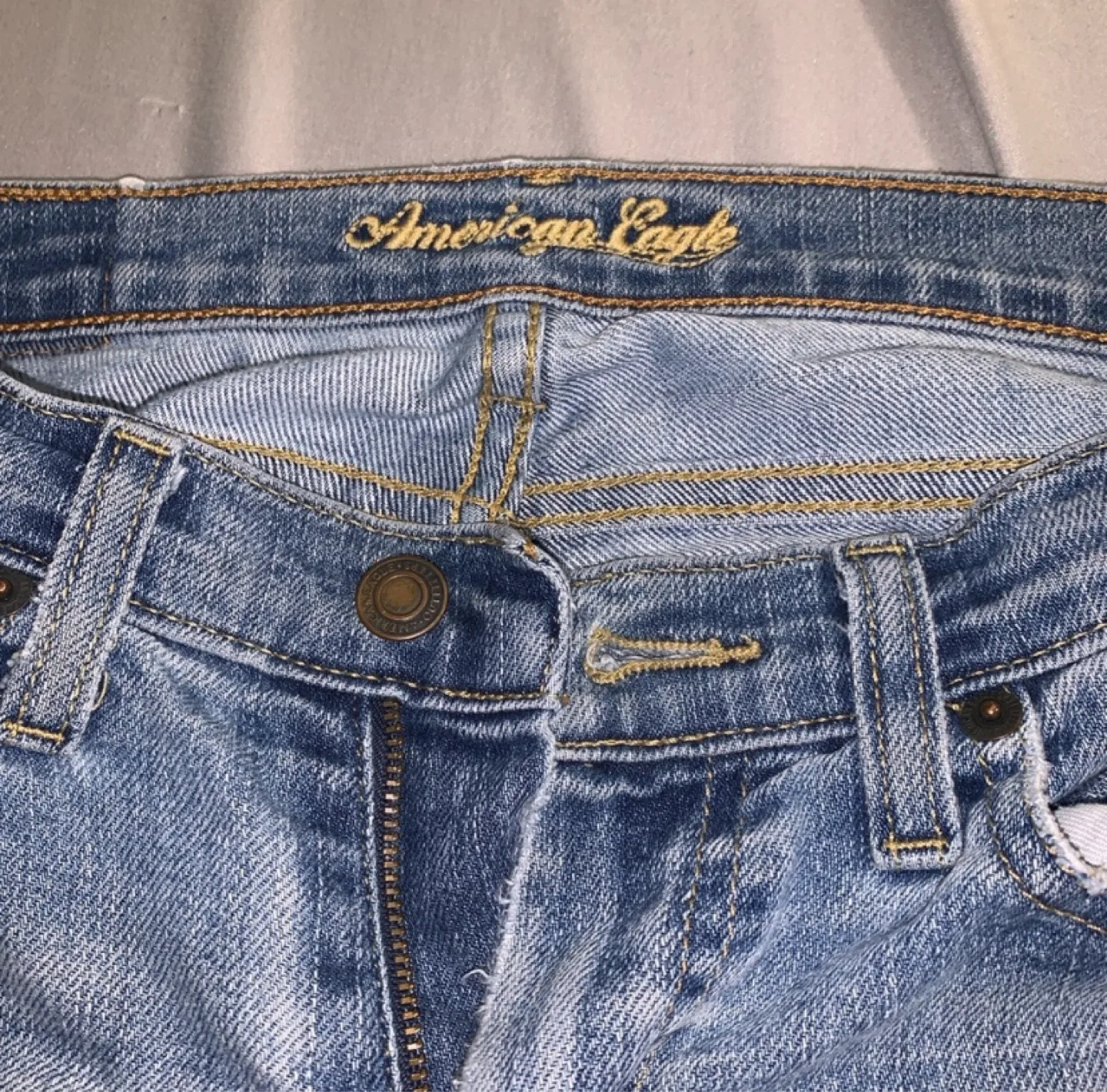 American Eagle Ripped Flare Jeans image indicator(2)