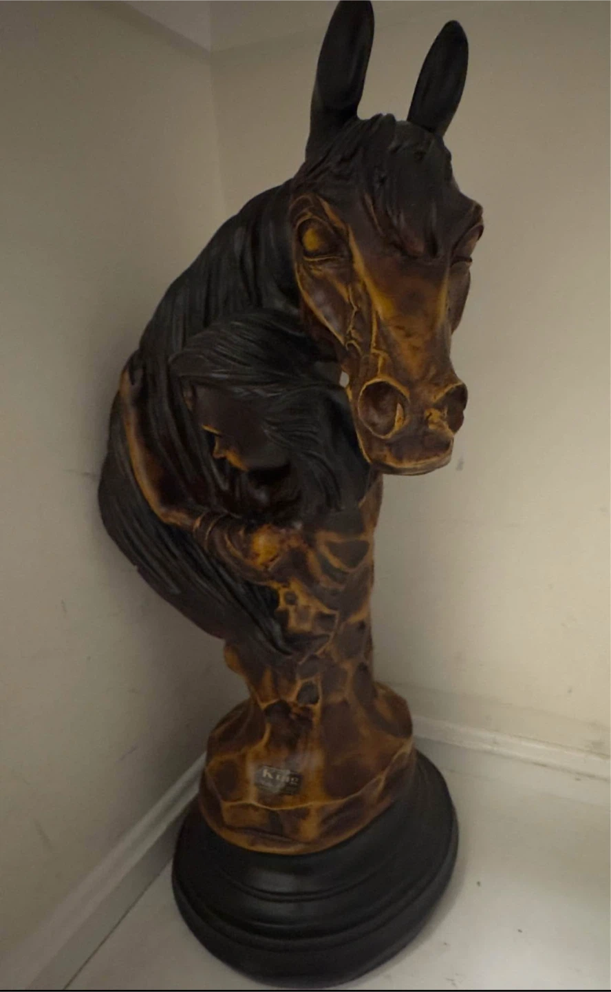 Horse bust sculpture with women