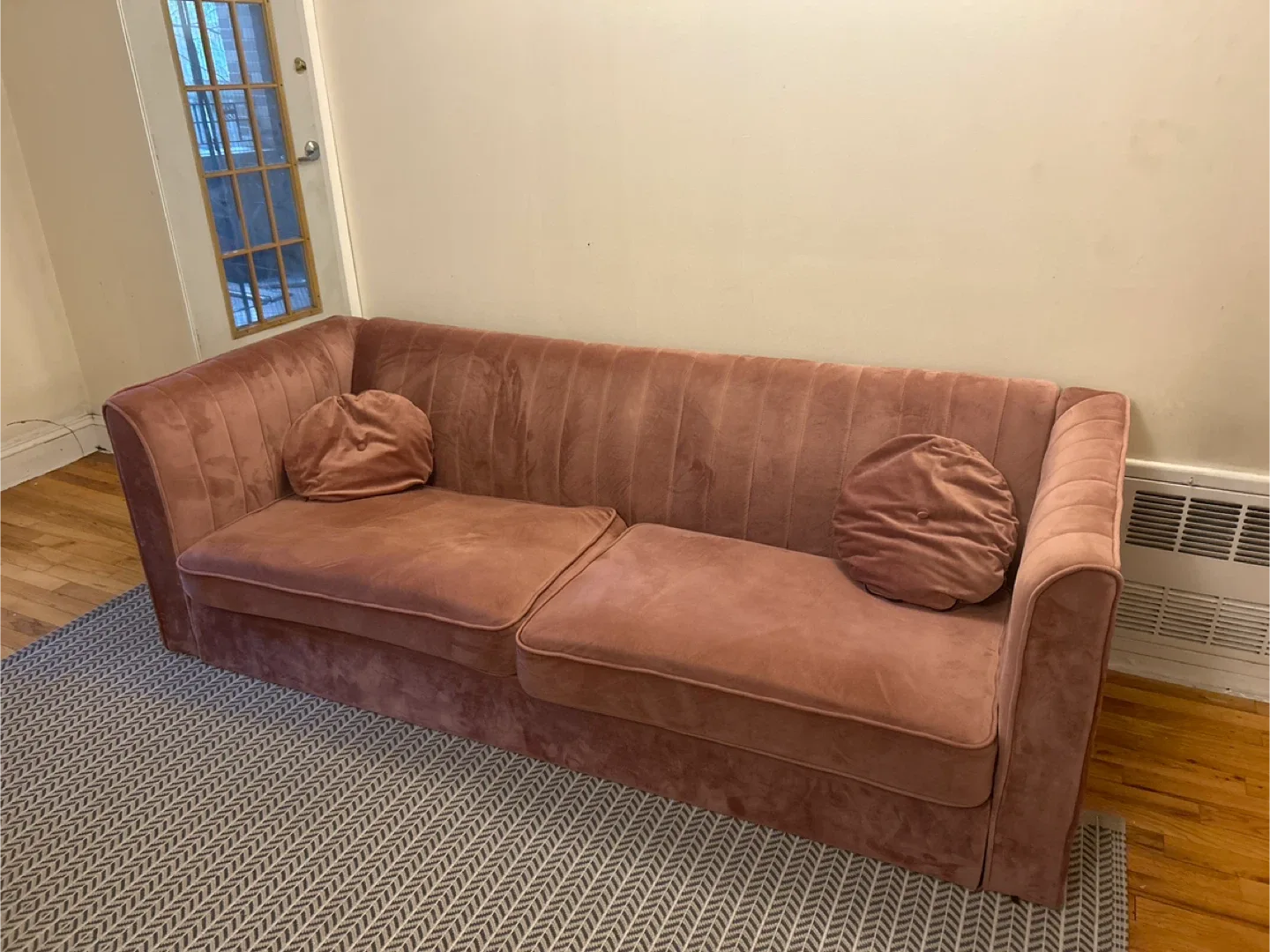 Pink Velvet Sofa with Round Pillows