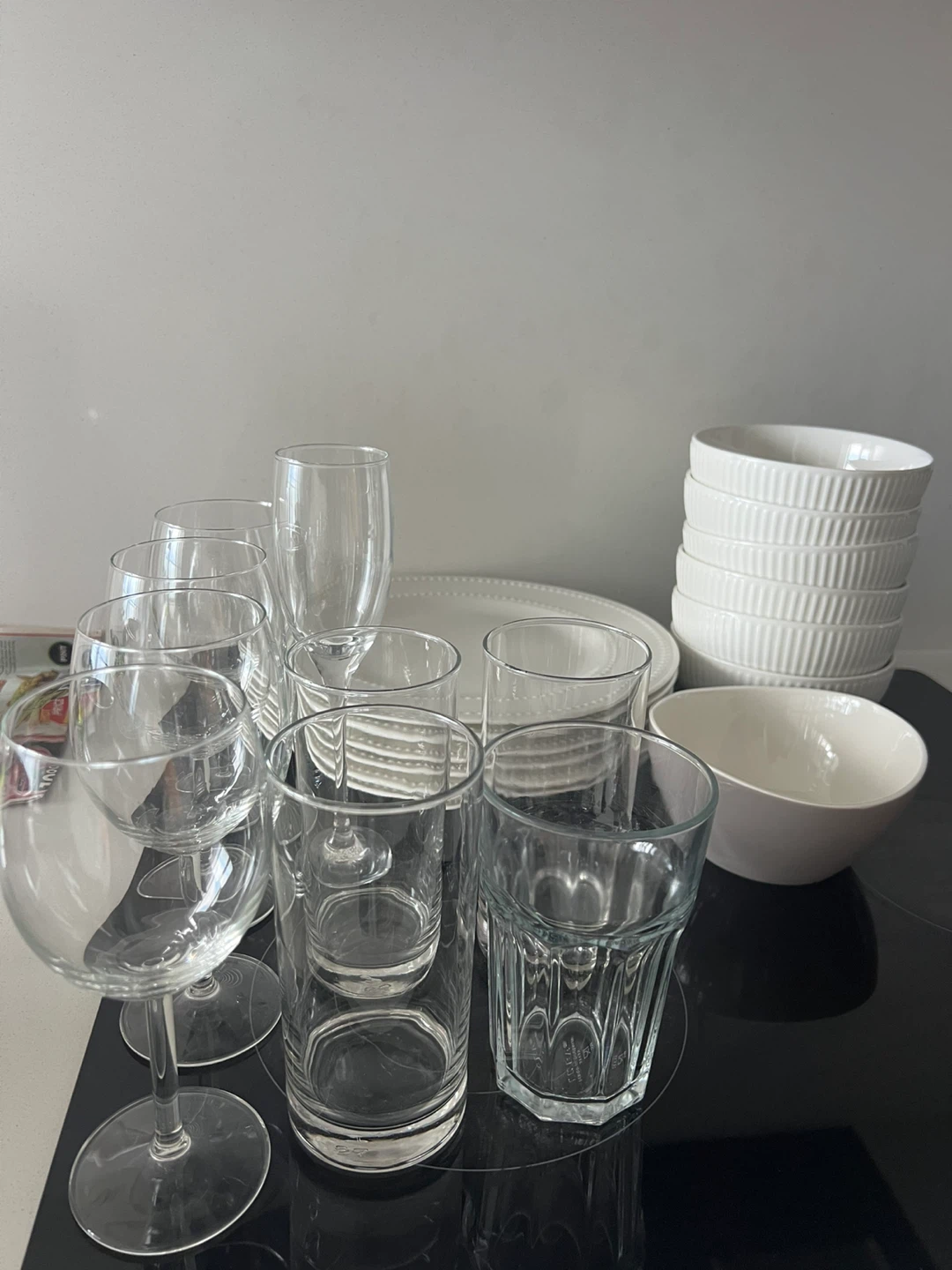 White Dinner Plates and Bowls Set, including glasses.
