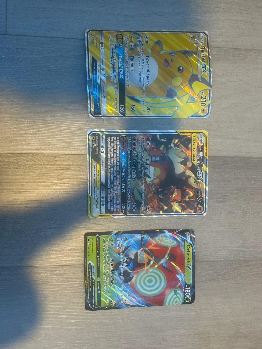 Pokemon Raichu GX, Charizard GX, Orbeetle V Cards thumbnail