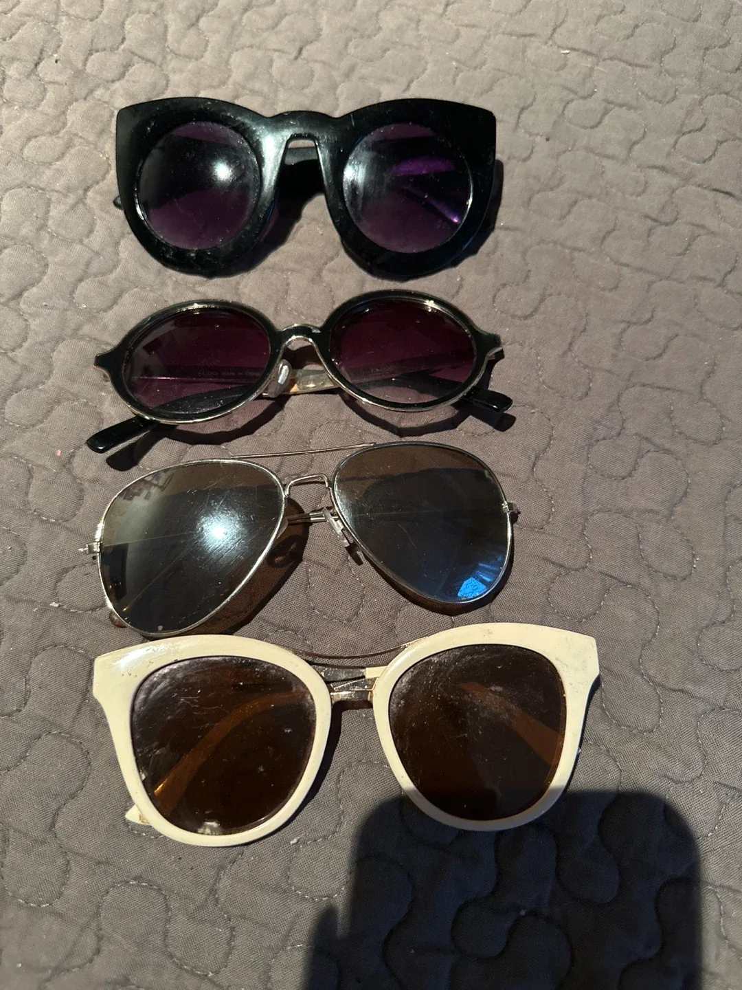 Four pairs of sunglasses thumbnail