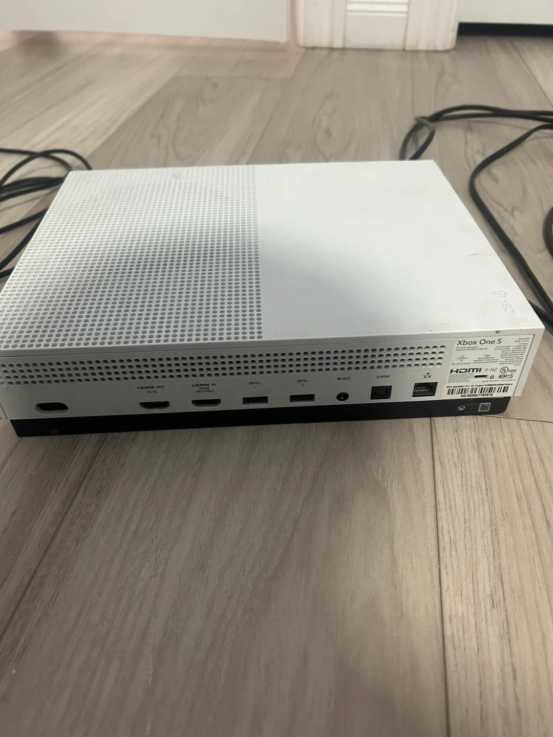 Xbox One S with controllers and games image indicator(5)