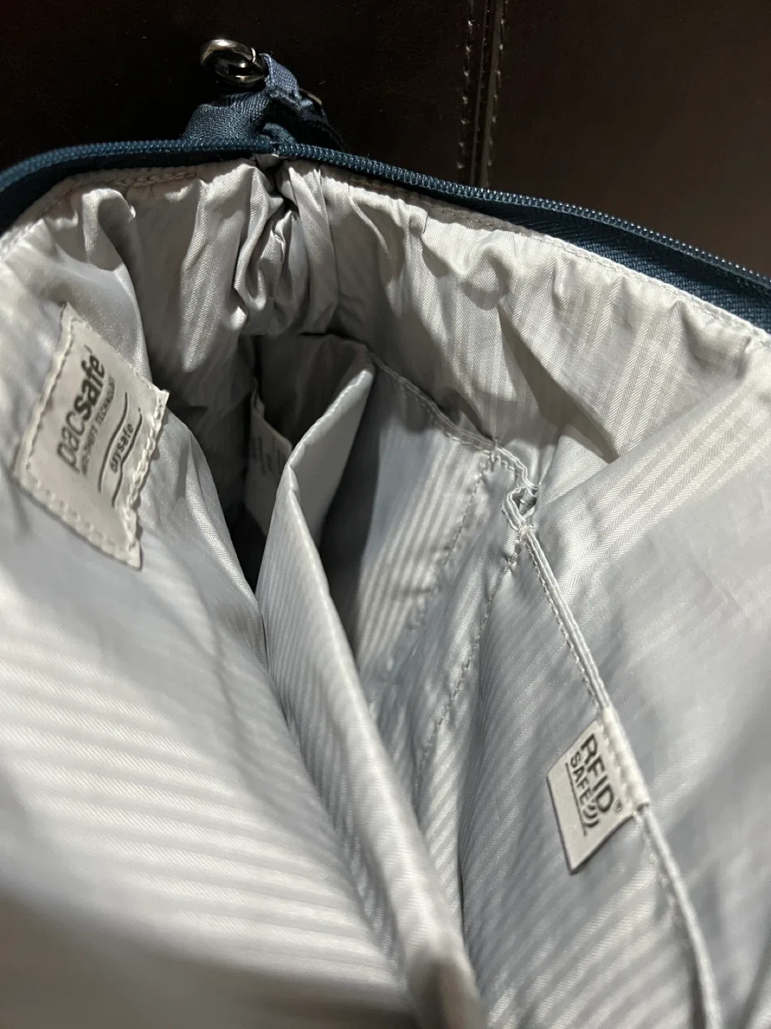 RFID safe crossbody bag by Pacsafe image indicator(2)