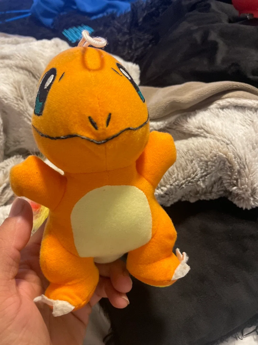 Pokémon a stuffed animal Charmander thumbnail
