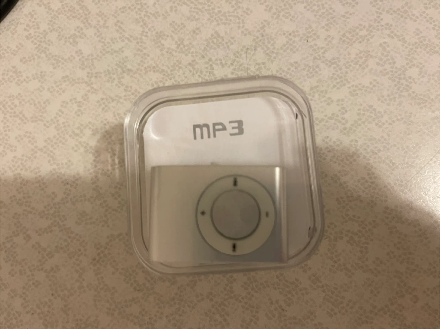 Apple iPod Shuffle MP3 Player and ear bugs