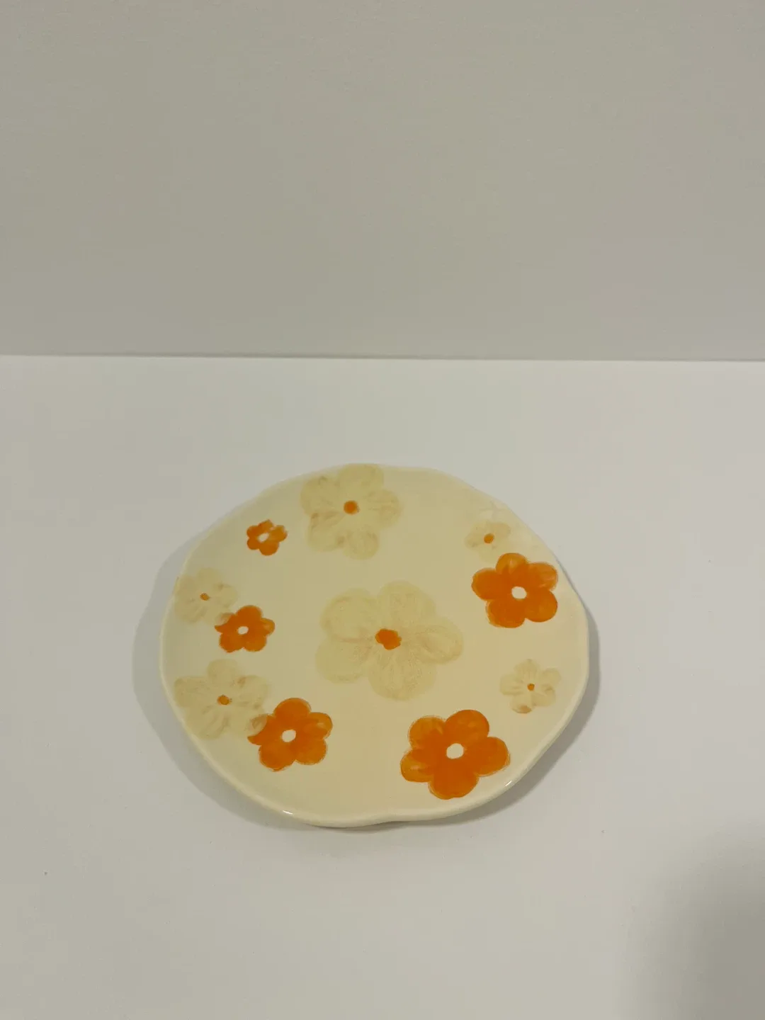 Saucer with orange floral print image indicator(2)