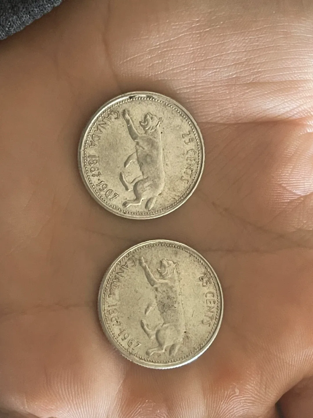 Two 1967 Canadian 25 Cent Coins image indicator(2)