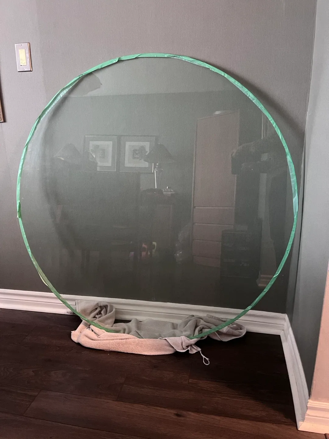 Round glass table top 48” - taped edge which will be removed