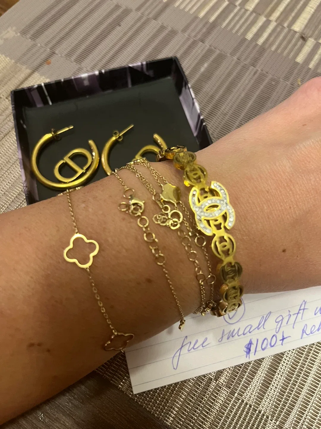 Dior logo Earrings and Chanel Bracelet image indicator(3)