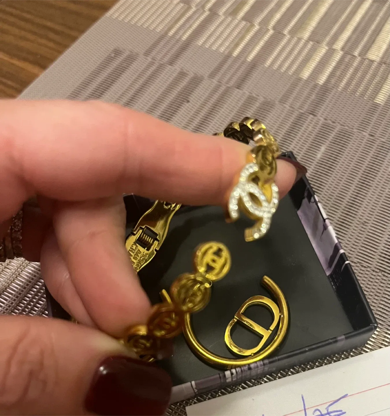 Dior logo Earrings and Chanel Bracelet image indicator(2)