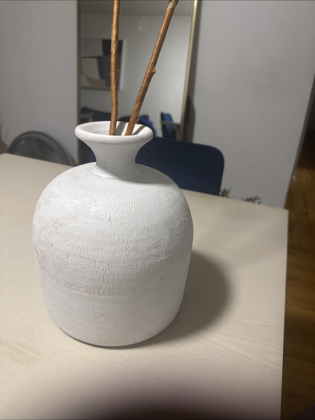 White Ceramic Vase with Sticks