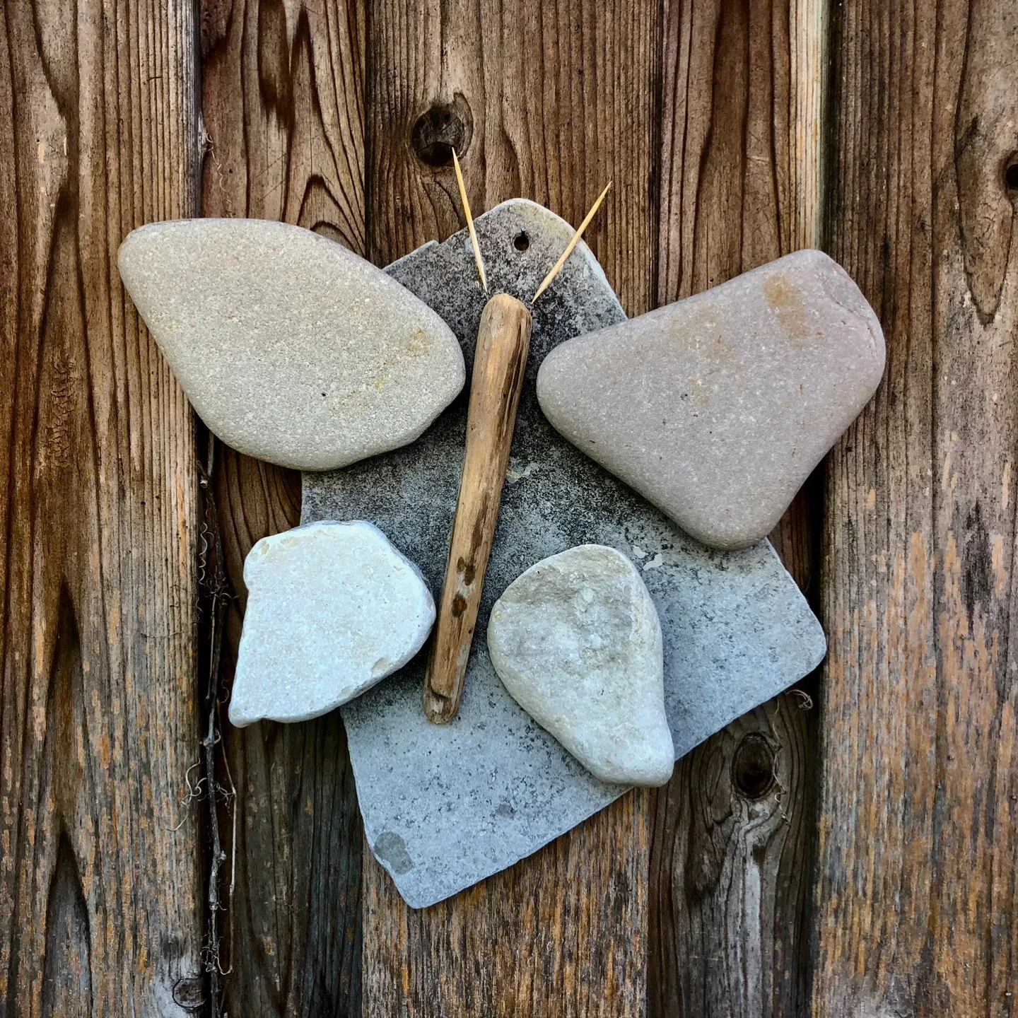 Art created by hand with driftwood and stone image indicator(3)