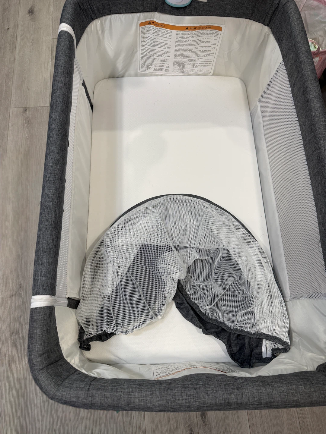 Baby  Bassinet - Grey and the toy attached
