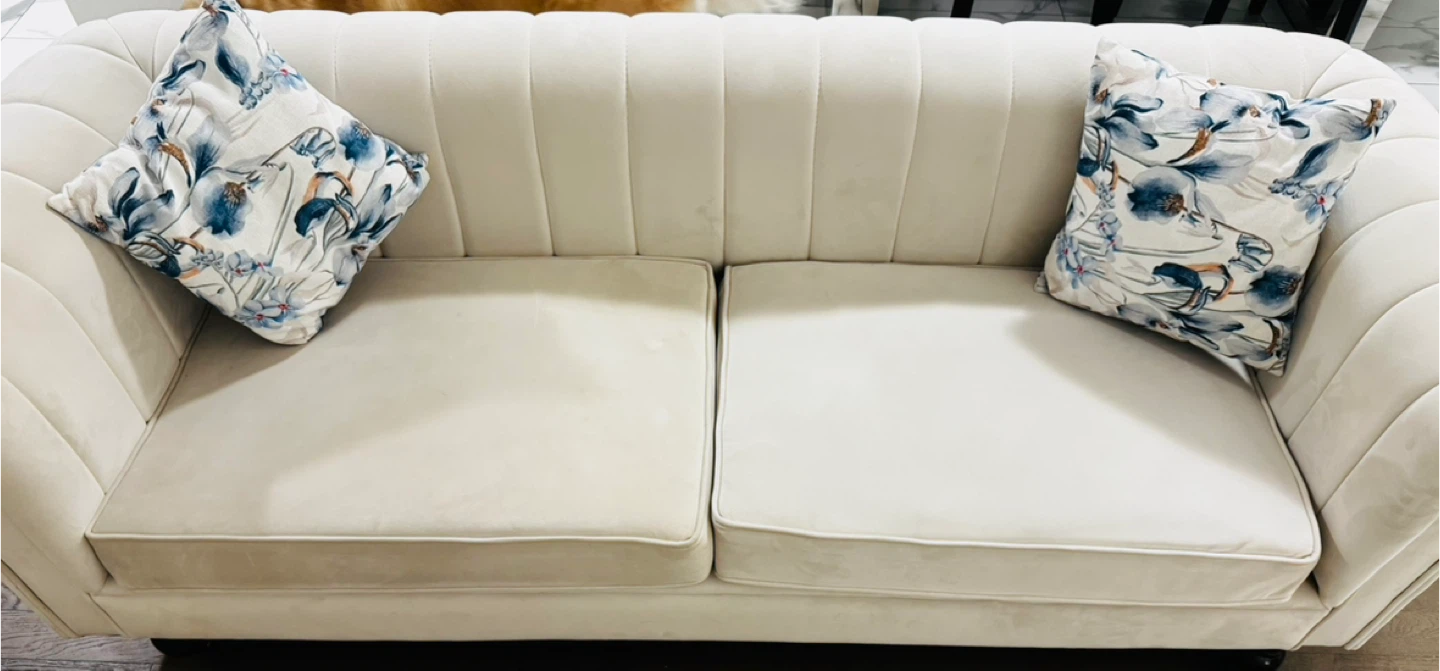 Beige Loveseat Sofa with Floral Pillows
