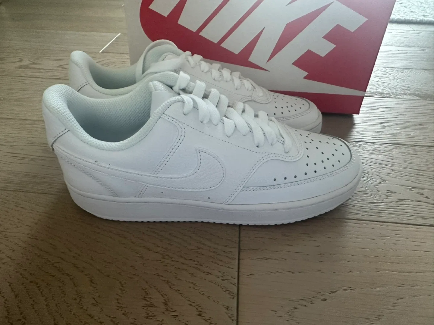 New white Nike court vision sneakers image indicator(2)