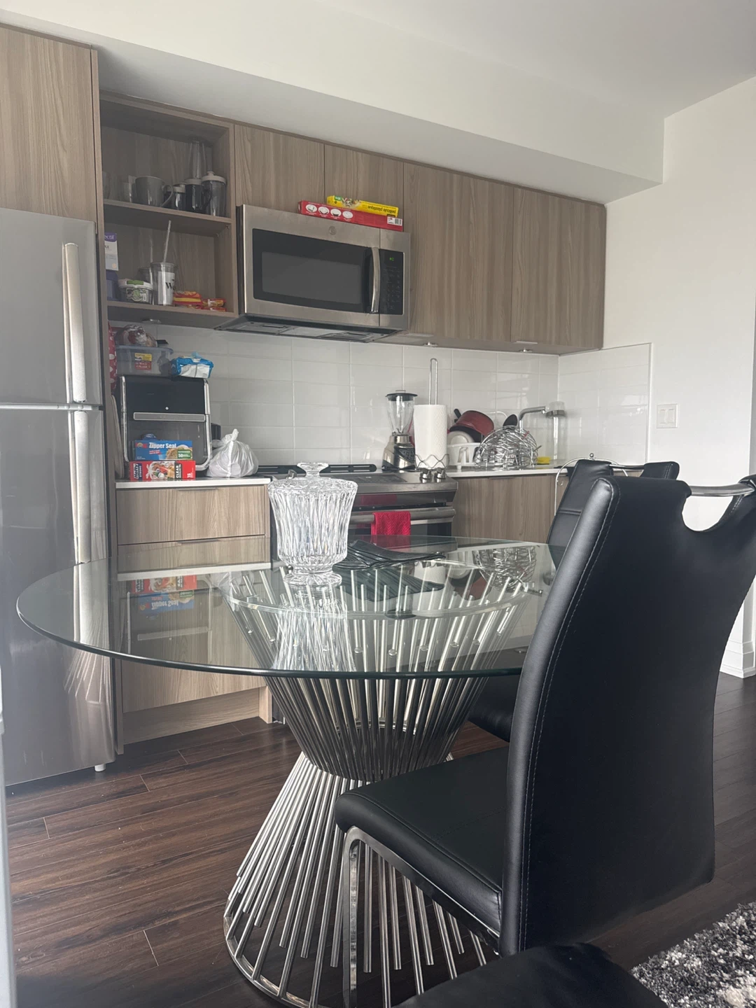 Glass Top Dining Table with 4 Black Chairs