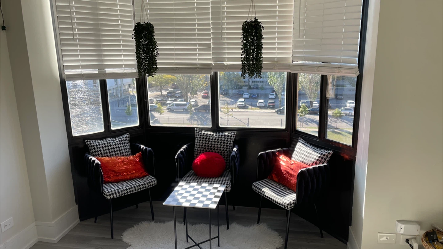 A modern seating area with a stylish table and chairs.