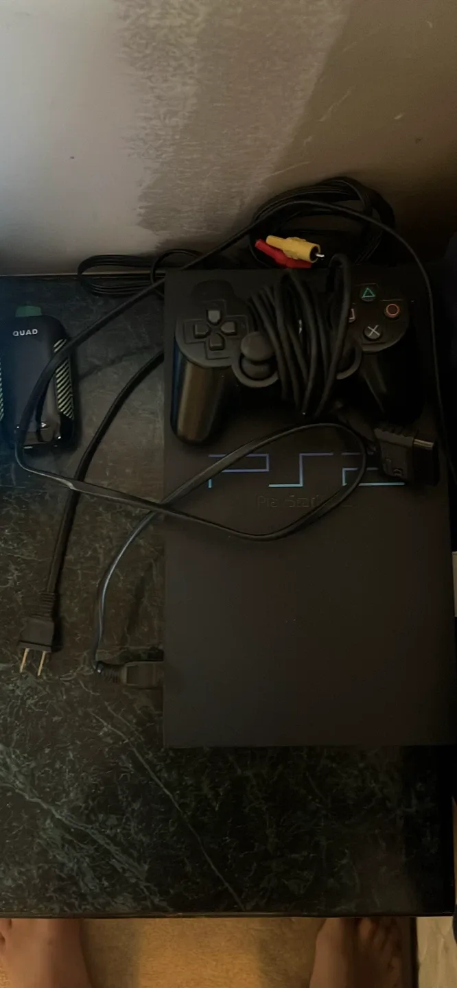 PlayStation 2 Console with NHL 06 Game image indicator(2)