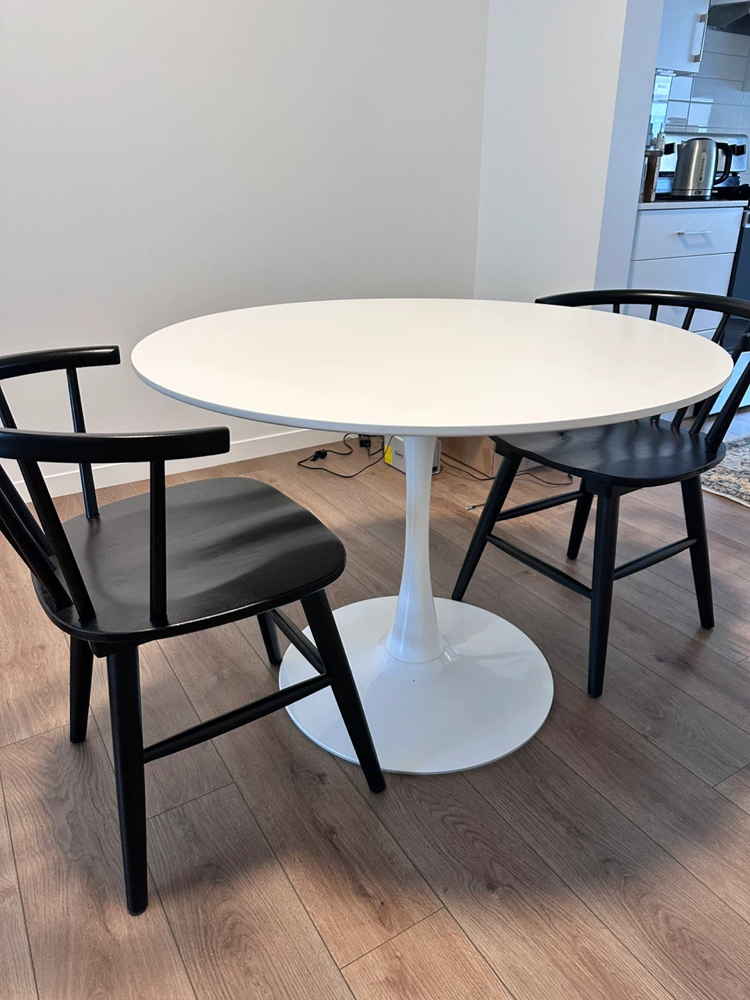Round White Tulip Table with Black Chairs - photo 3