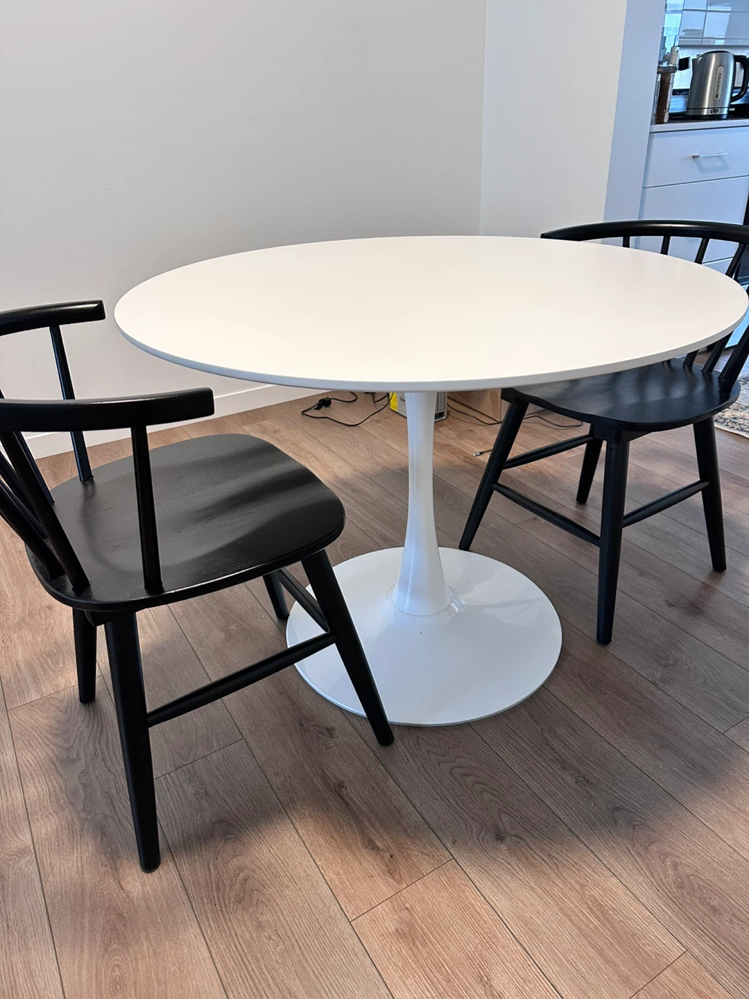 Round White Tulip Table with Black Chairs - photo 2