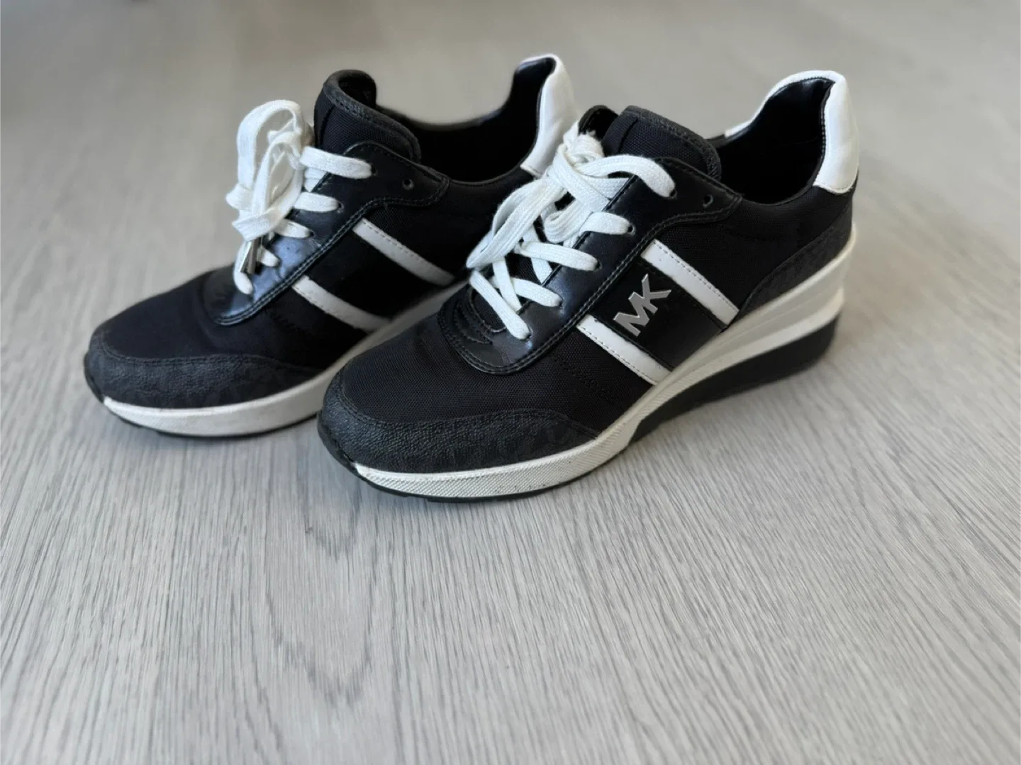 Michael Kors Black & White Sneakers. image indicator(2)