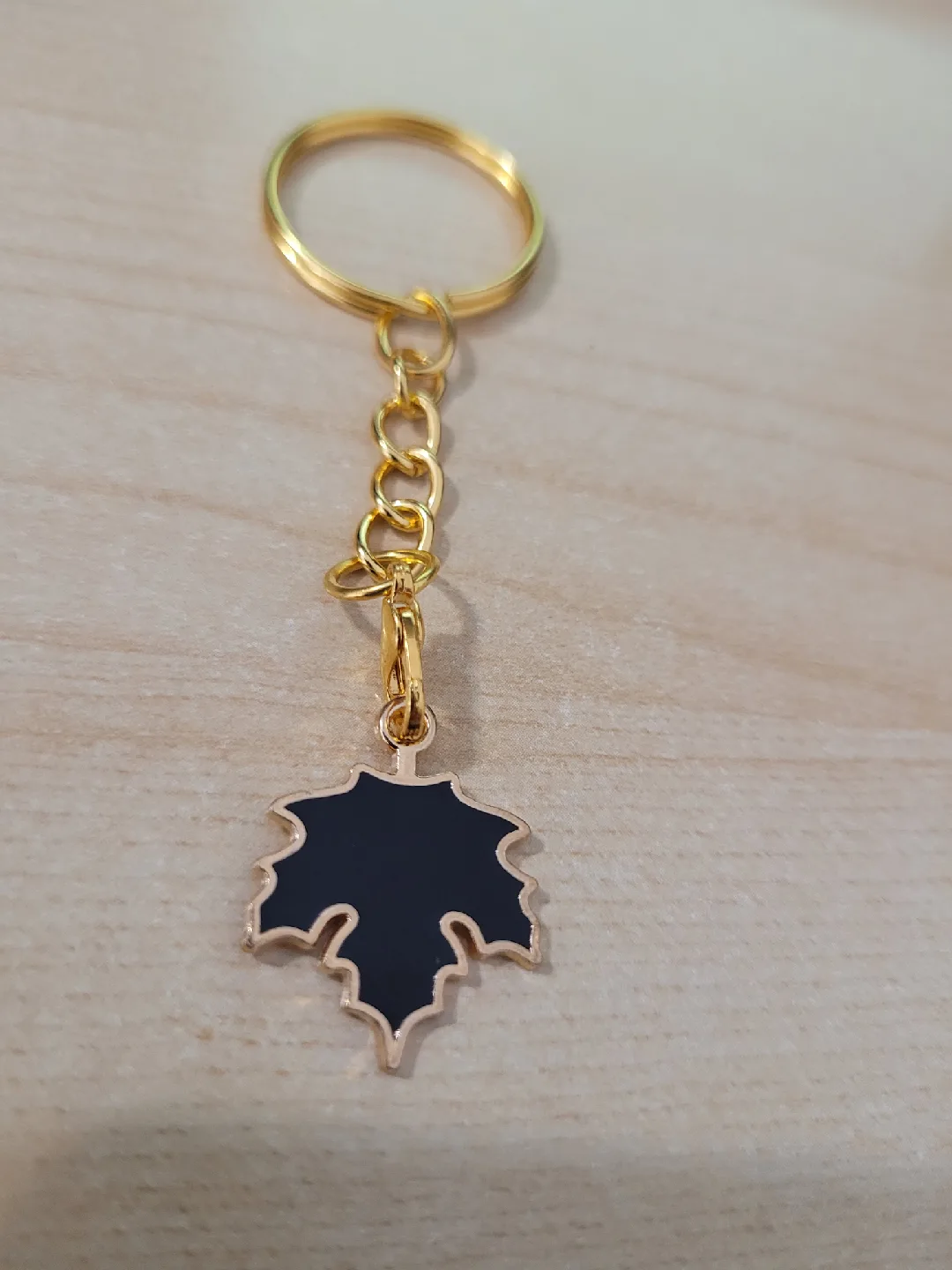 Maple Leaf Keychain - Black & Golden image indicator(2)