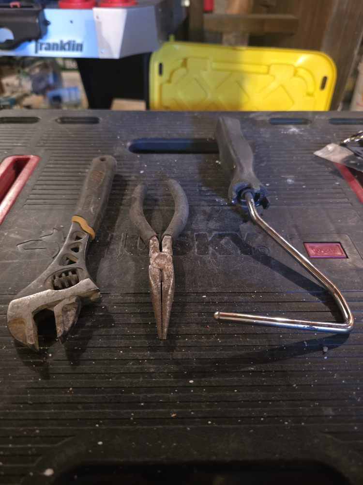 Used Adjustable Wrench, Pliers, and Paint Roller