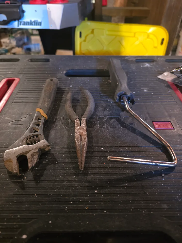 Used Adjustable Wrench, Pliers, and Paint Roller thumbnail