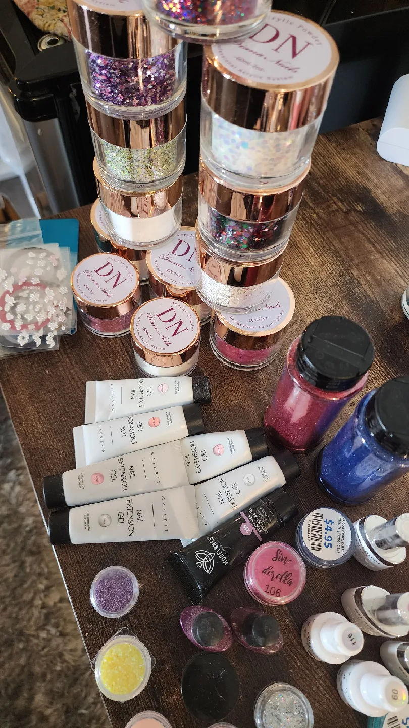 Variety of Nail Art Supplies: Powders, Gels, Glitters image indicator(4)