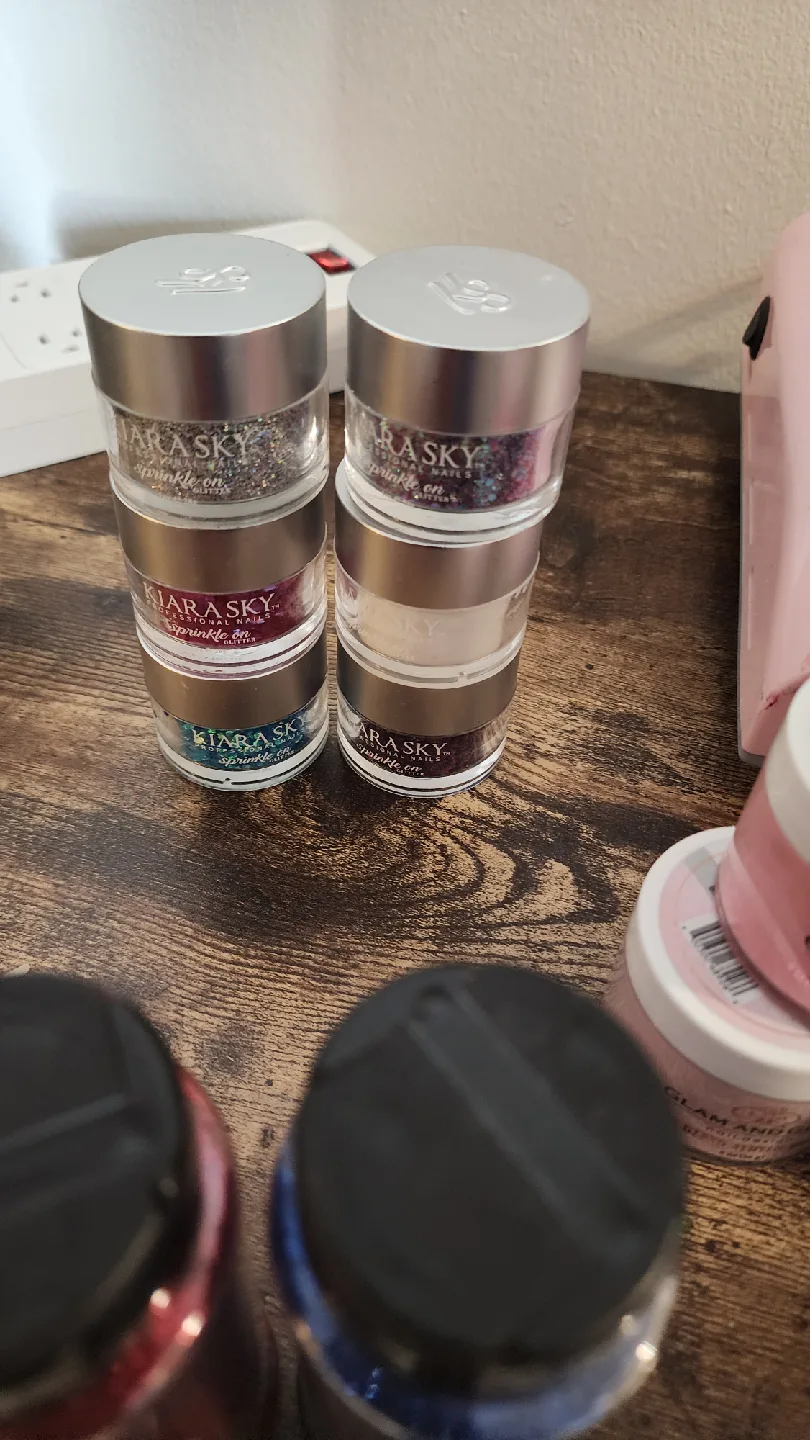 Variety of Nail Art Supplies: Powders, Gels, Glitters image indicator(5)